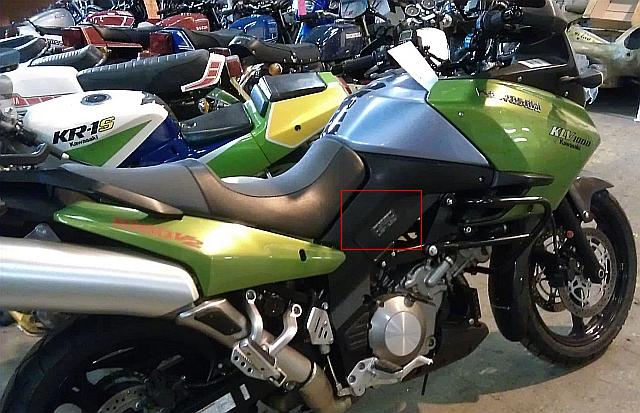 kawasaki klv 1000 in green with a red box to highlight the vin plate on the side of the frame